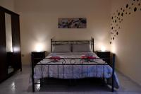 Posteľ alebo postele v izbe v ubytovaní B&B a Capua - I PORTICI del centro