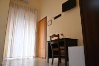 Televízia a/alebo spoločenská miestnosť v ubytovaní B&B a Capua - I PORTICI del centro