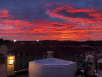 The sunrise or sunset as seen from a panziókat or nearby