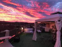 The sunrise or sunset as seen from a panziókat or nearby