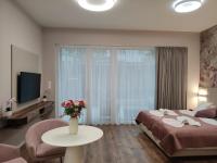 Posteľ alebo postele v izbe v ubytovaní Spa Residence Carbona Mona Lila Apartman