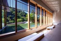 a large room with large windows and a pool at Wulai Pause Landis Resort in Wulai