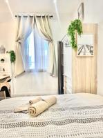 Łóżko lub łóżka w pokoju w obiekcie Defoy Getaway - Antibes
