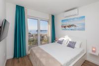 Posteľ alebo postele v izbe v ubytovaní Seabreeze Apartments Cavtat