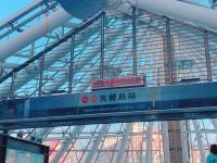 a train station with a sign on a bridge at Centre Hotel in Kaohsiung