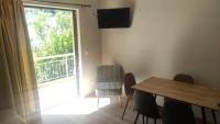 A television and/or entertainment centre at Vasileiou Apartments