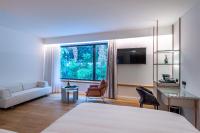 Łóżko lub łóżka w pokoju w obiekcie Amario Suites Hotel