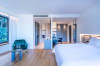 Łóżko lub łóżka w pokoju w obiekcie Amario Suites Hotel