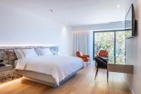 Łóżko lub łóżka w pokoju w obiekcie Amario Suites Hotel