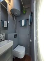 a small bathroom with a toilet and a sink at Modern Design One Bedroom Apartment in Paris