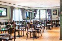 a dining room filled with tables and chairs at The Reston Hotel, Part of AG Collection in Washington