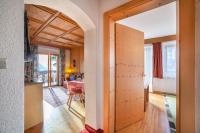 A bed or beds in a room at Adang Ferienwohnung Etschtal