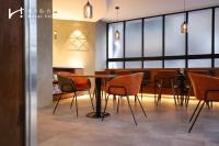 a dining room with a table and chairs at Hotel Initial-Taichung in Taichung