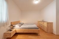 A bed or beds in a room at Stürz Ferienwohnungen