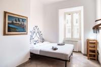 A bed or beds in a room at Casa Futura Trastevere