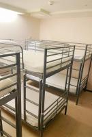 a group of bunk beds in a room at Single inn- KAOHSIUNG LINSEN in Kaohsiung