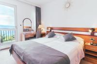 Posteľ alebo postele v izbe v ubytovaní Hotel Horizont