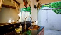 a bathroom with a sink and a shower at Koh Jum Beach Villas "A member of Secret Retreats" in Ko Jum