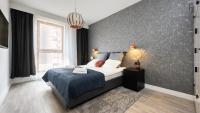 Posteľ alebo postele v izbe v ubytovaní Flatbook - City Center SPA Apartments Toruńska
