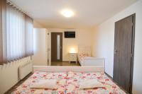 Postel nebo postele na pokoji v ubytování Apartmány Zaječák