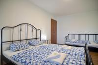 Postel nebo postele na pokoji v ubytování Apartmány Zaječák