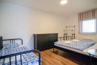 Postel nebo postele na pokoji v ubytování Apartmány Zaječák
