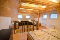 Postel nebo postele na pokoji v ubytování Apartmány Zaječák