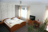 Łóżko lub łóżka w pokoju w obiekcie Hotel Vega