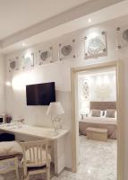 Telewizja i/lub zestaw kina domowego w obiekcie FLOS Guest House