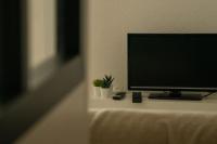 Telewizja i/lub zestaw kina domowego w obiekcie Studio Ouistreham entre centre-ville et plages
