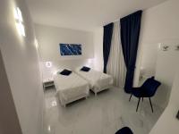 A bed or beds in a room at Hotel Smart Cruise