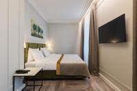VICTORIA Hotel Klaipėdaにあるベッド
