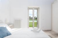 Posteľ alebo postele v izbe v ubytovaní Villa Trullina by Raro Villas