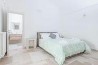 Posteľ alebo postele v izbe v ubytovaní Villa Trullina by Raro Villas