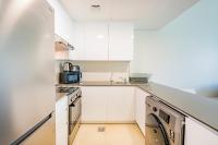 Expo Village Serviced Apartmentsにあるキッチンまたは簡易キッチン