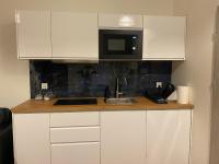 Kuchyňa alebo kuchynka v ubytovaní Apartamenty Mikubo Wrocław