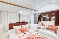 a bedroom with two beds with flowers on them at Luxury Collection &amp; Resort in Cormeilles-en-Parisis