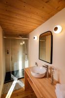 a bathroom with a sink and a mirror at Domaine Agricole Cotzé &#47; Casa rural in Enveitg