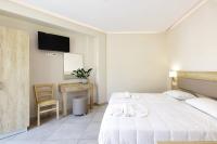Posteľ alebo postele v izbe v ubytovaní Theo Star Beach Hotel