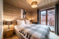 Posteľ alebo postele v izbe v ubytovaní Apartment Cervino Monriond Courchevel - by EMERALD STAY