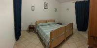 A bed or beds in a room at Casa vacanze Barvis