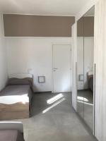 A bed or beds in a room at Scogliera apartments