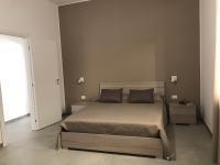 A bed or beds in a room at Scogliera apartments