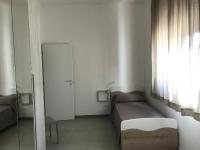 A bed or beds in a room at Scogliera apartments
