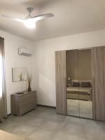 A bed or beds in a room at Scogliera apartments