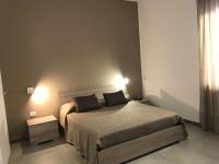 A bed or beds in a room at Scogliera apartments