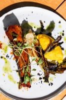 a white plate with food on a table at Domaine Gao in Aix-en-Provence