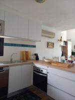 Kuchyňa alebo kuchynka v ubytovaní Precioso apartamento en complejo con piscina