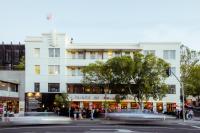 a large white building with people standing outside of it at The Prince in Melbourne