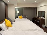 LIT’S INN Sapporoにあるベッド